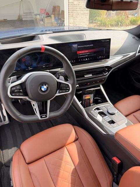 BMW M340i cockpit with cognac leather seats and carbon trim cleaned to a factory finish