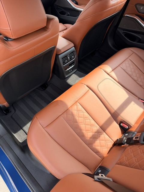 Cognac leather rear seats of a BMW M340i cleaned and conditioned